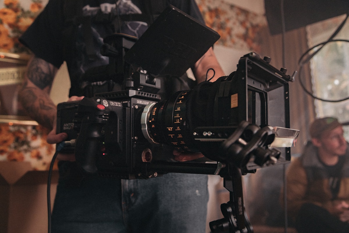 A cinematographer operating a professional cinema camera on set